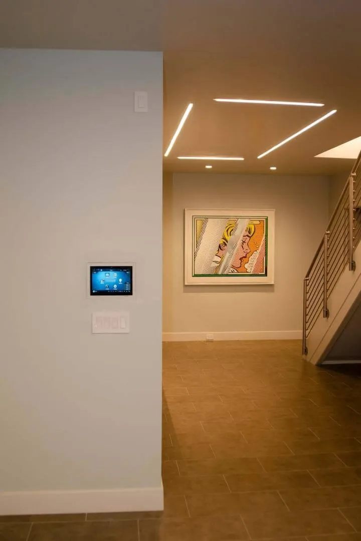 Room lighting controlled at the touch of a button with home automation installation