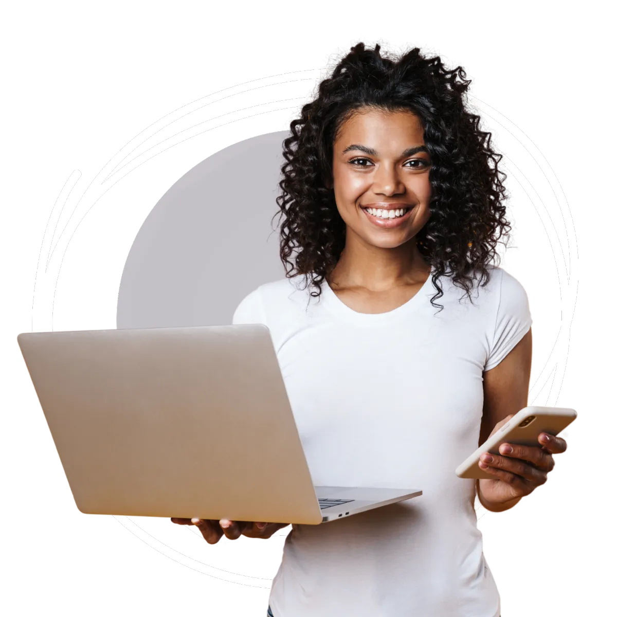 Woman holding a computer and a phone