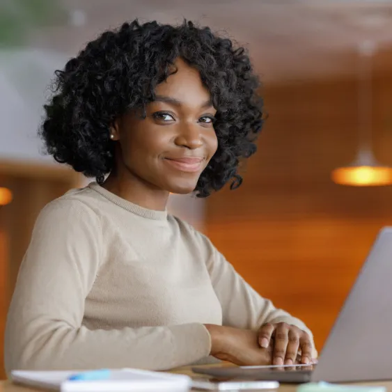 woman placing sticky notes on wall