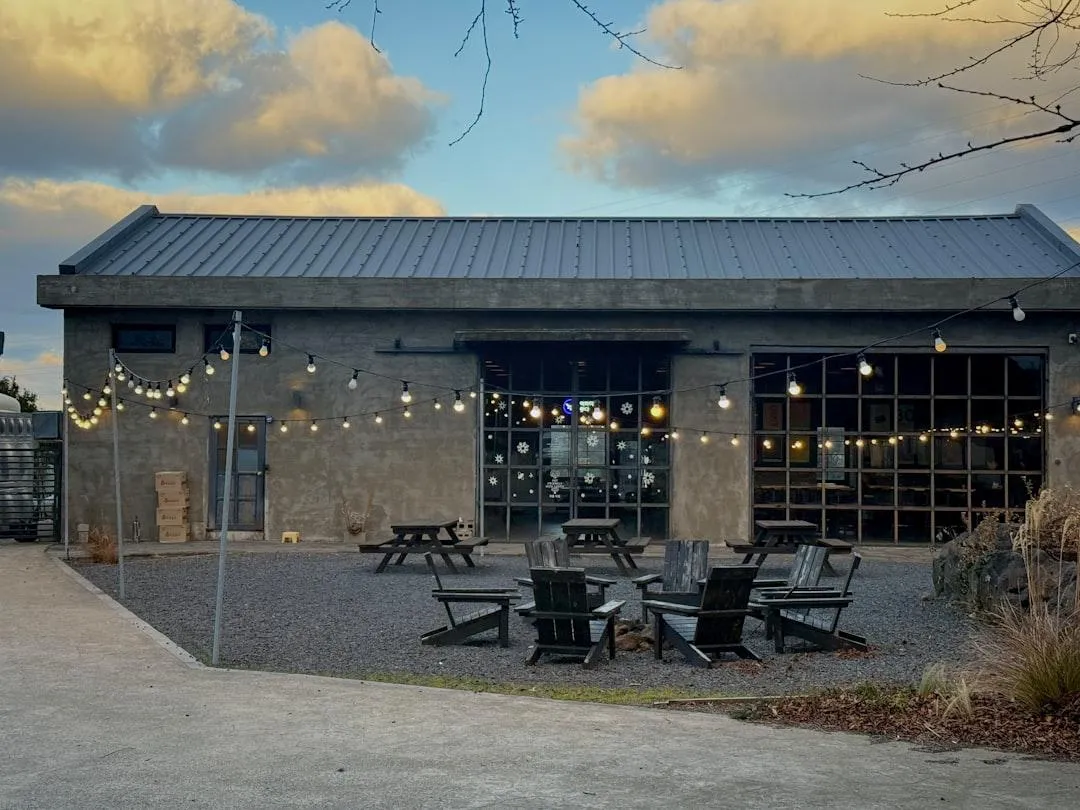 backyard outdoor area with gravel and chairs and tables
