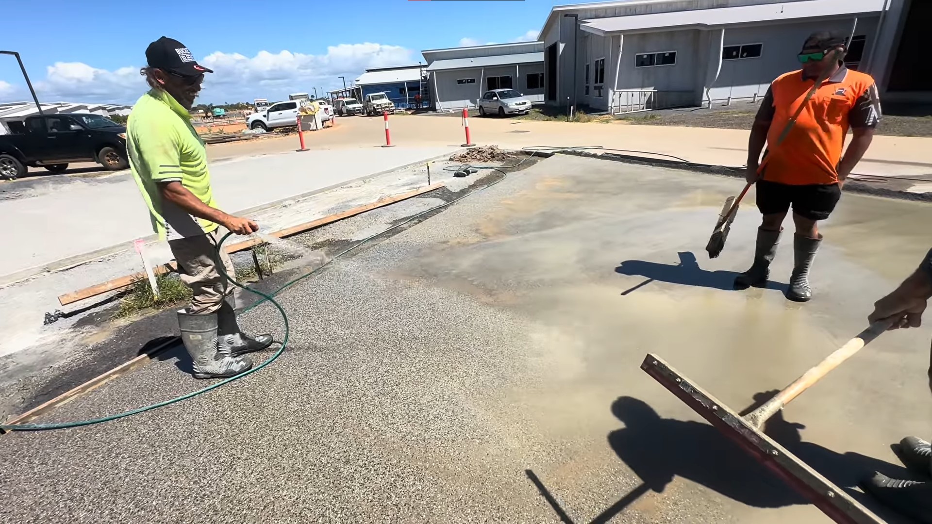 tradie spraying concrete to remove layer for exposed aggregate