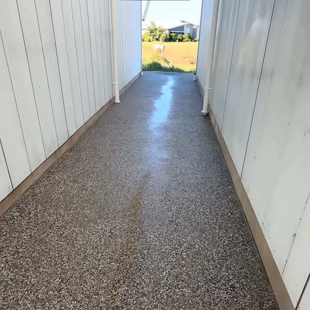 exposed aggregate pathway in between houses
