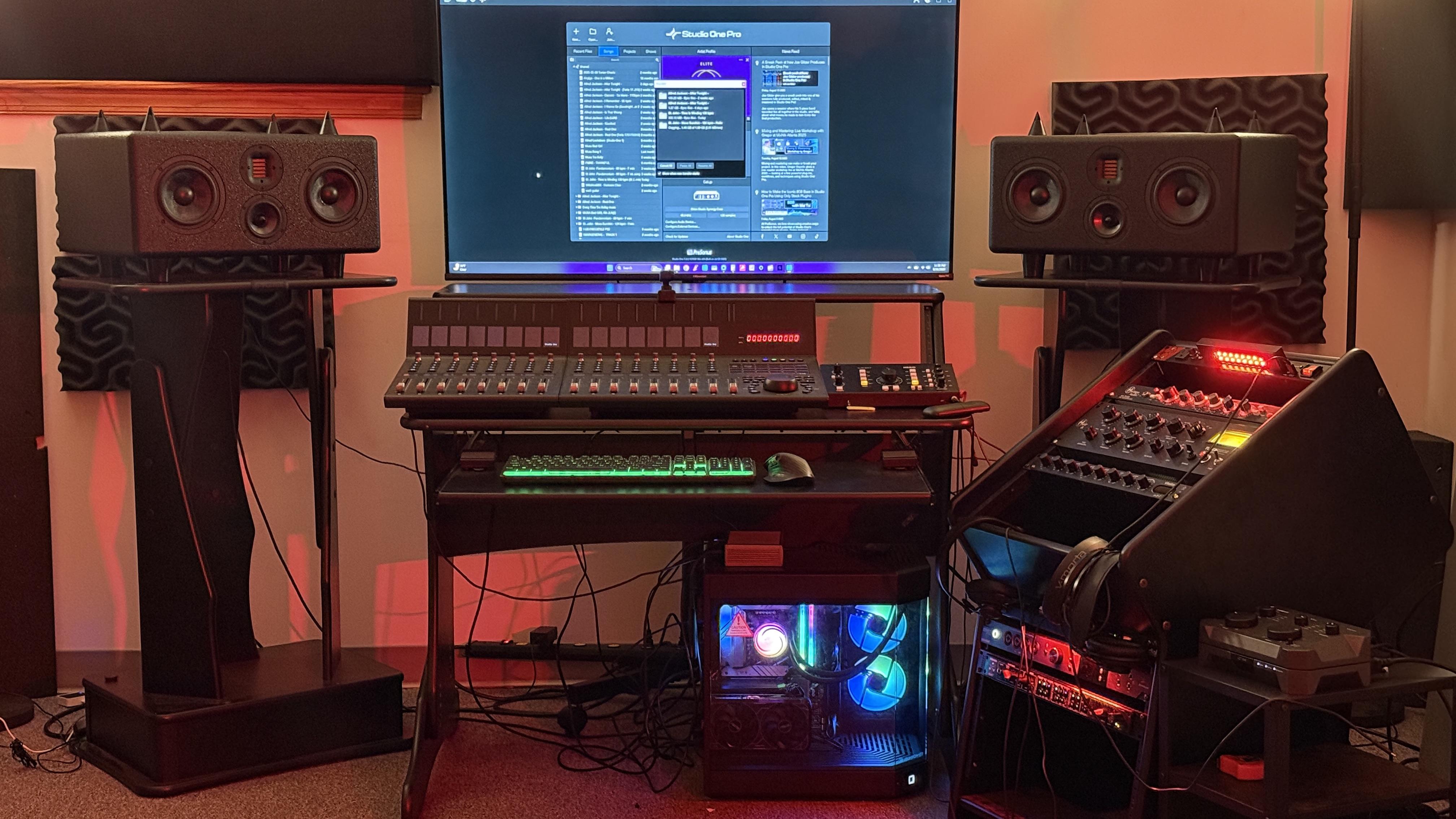 a room with three round windows and a potted plant