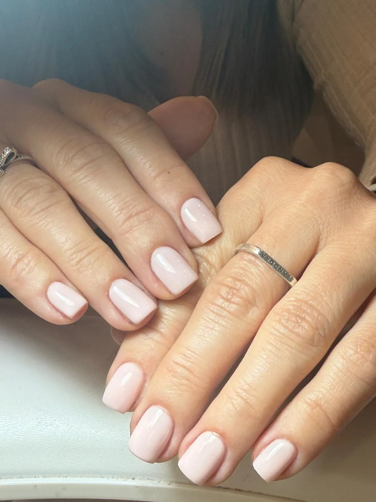 white and gold plastic bottles on brown wooden table