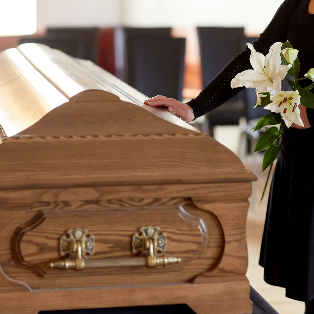 a women interacting with a voice memorial with Reliveable at funeral home