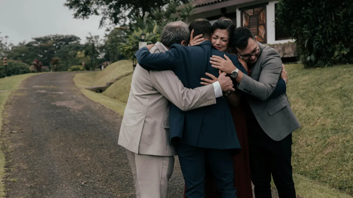 grieving family using Reliveable's interactive memorial services