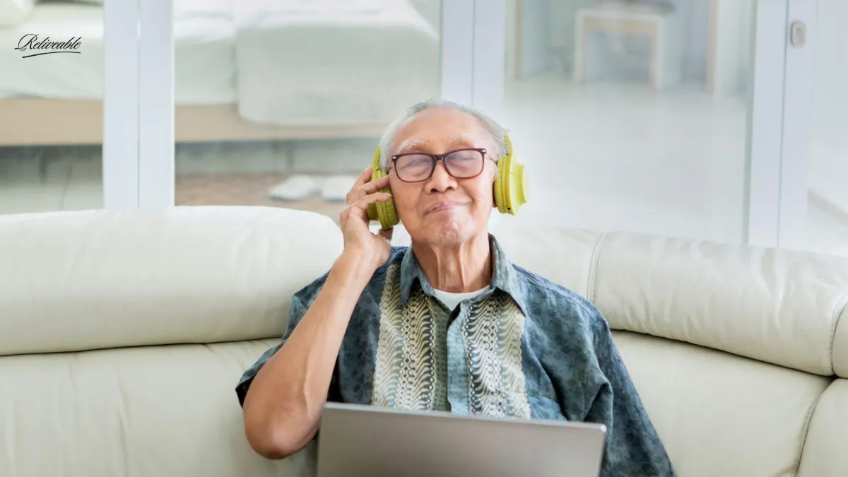 an older man listening to his late wife's legacy voice message provided by ReLiveable's ai memorial services