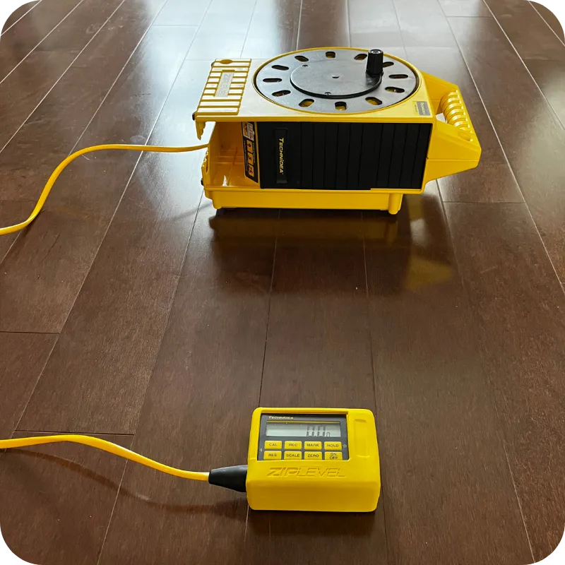 Zip Level foundation measurement tool used during a home inspection in Frisco TX to check floor elevation changes.