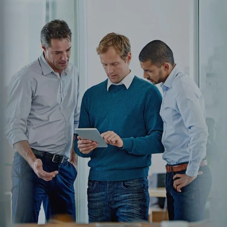 three men working together