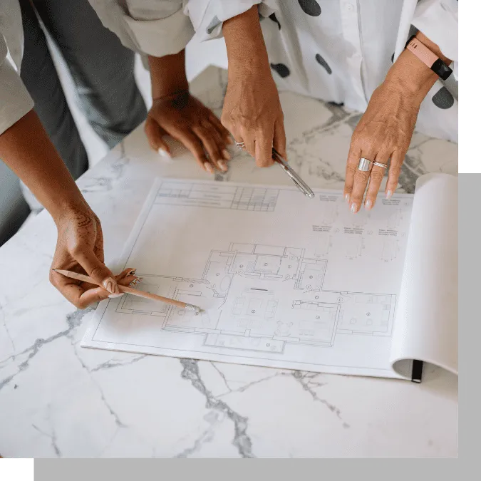 people looking at blueprints