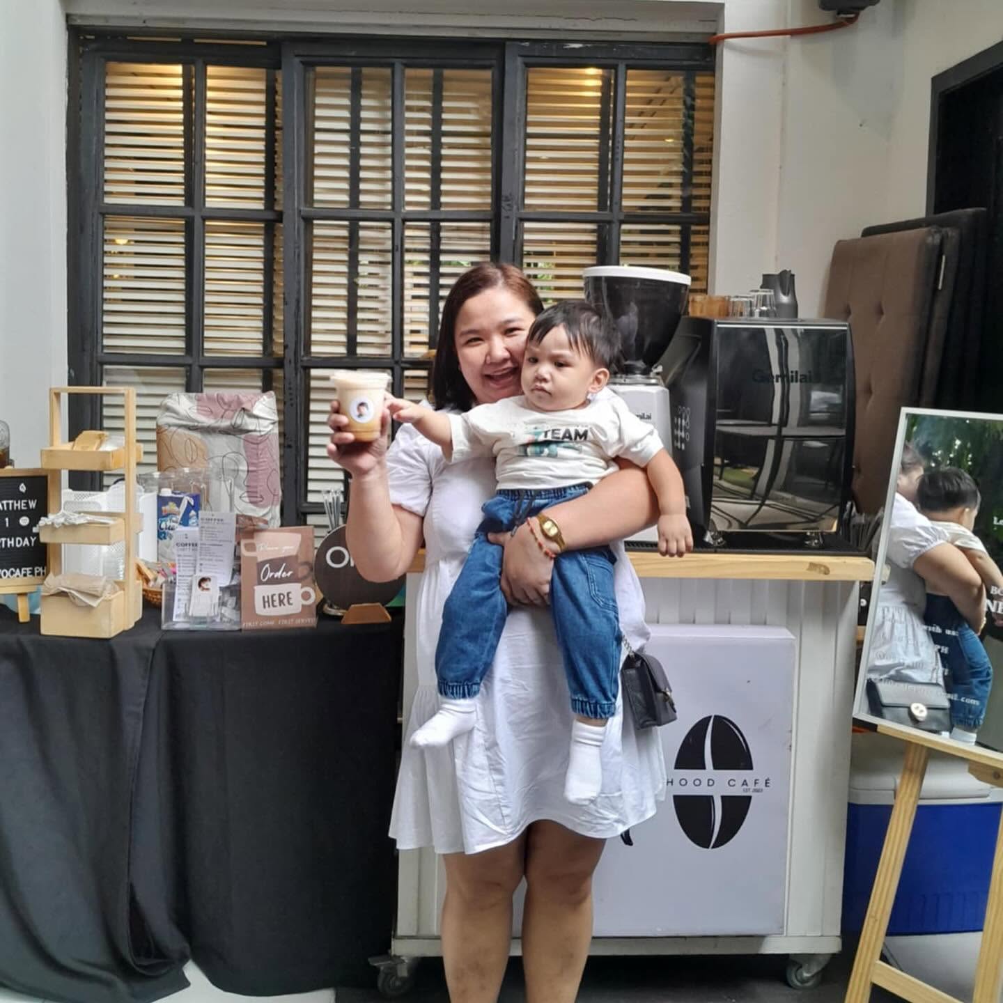 Custom styled coffee pop-up station with personalized cups, bespoke signage, and warm accents
