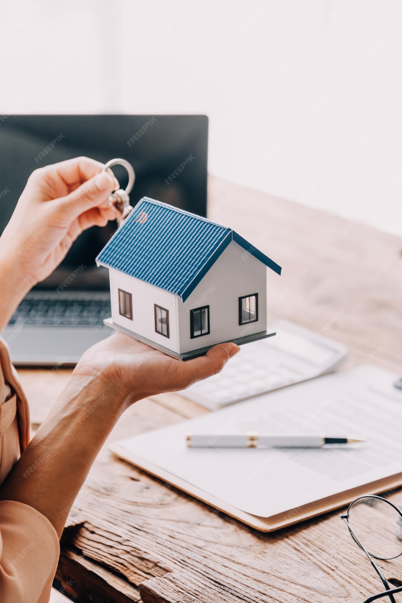 Couple reviewing mortgage options with advisor in modern office