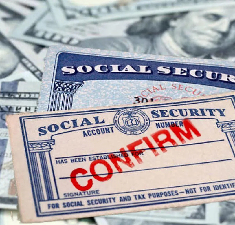 person holding love word cutout paper