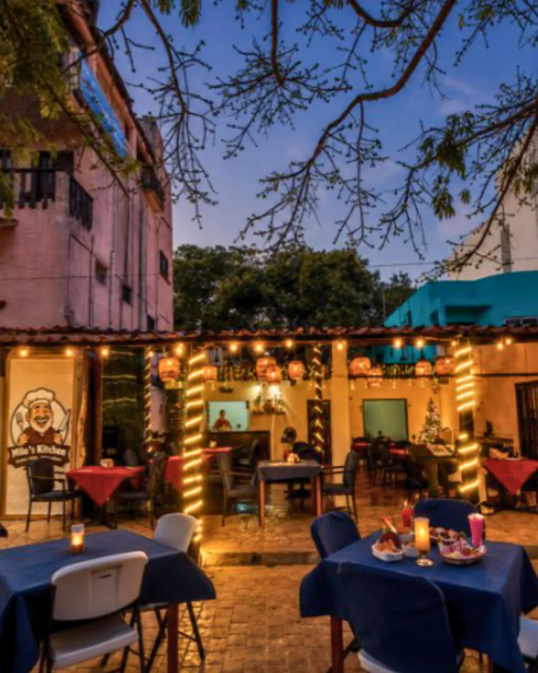 Exclusive tropical nocturnal beach gathering with neon lighting and relaxed social atmosphere