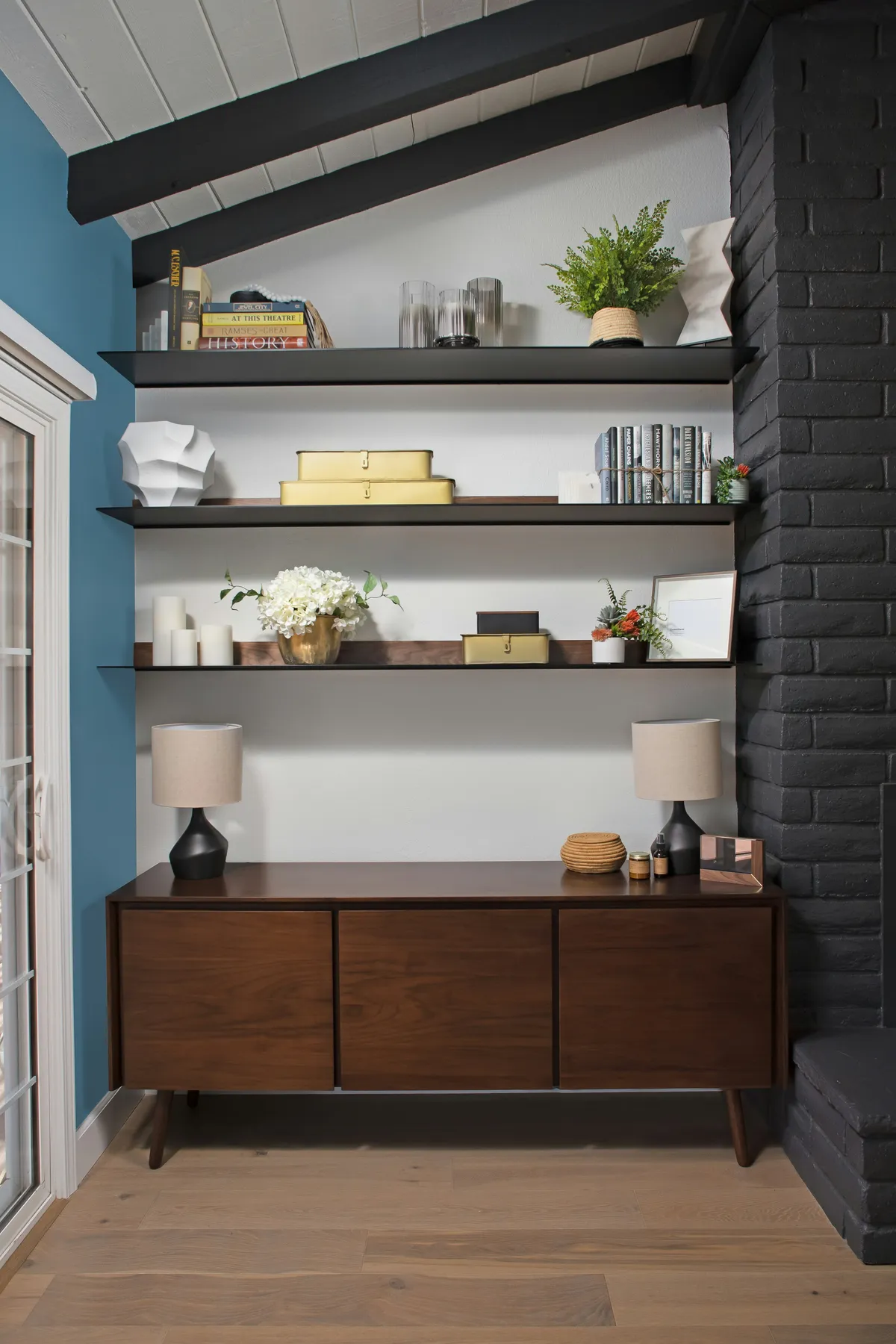 Wall-mounted shelves above a wood cabinet
