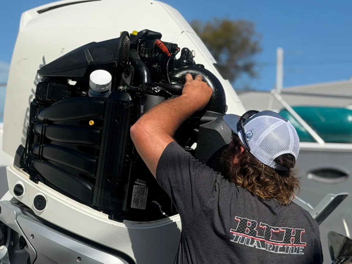Routine maintenance on mercury outboards at BTH Marine