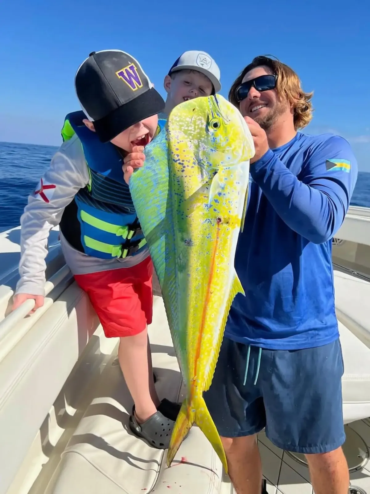 Blye holding a mahi that was just caught 
