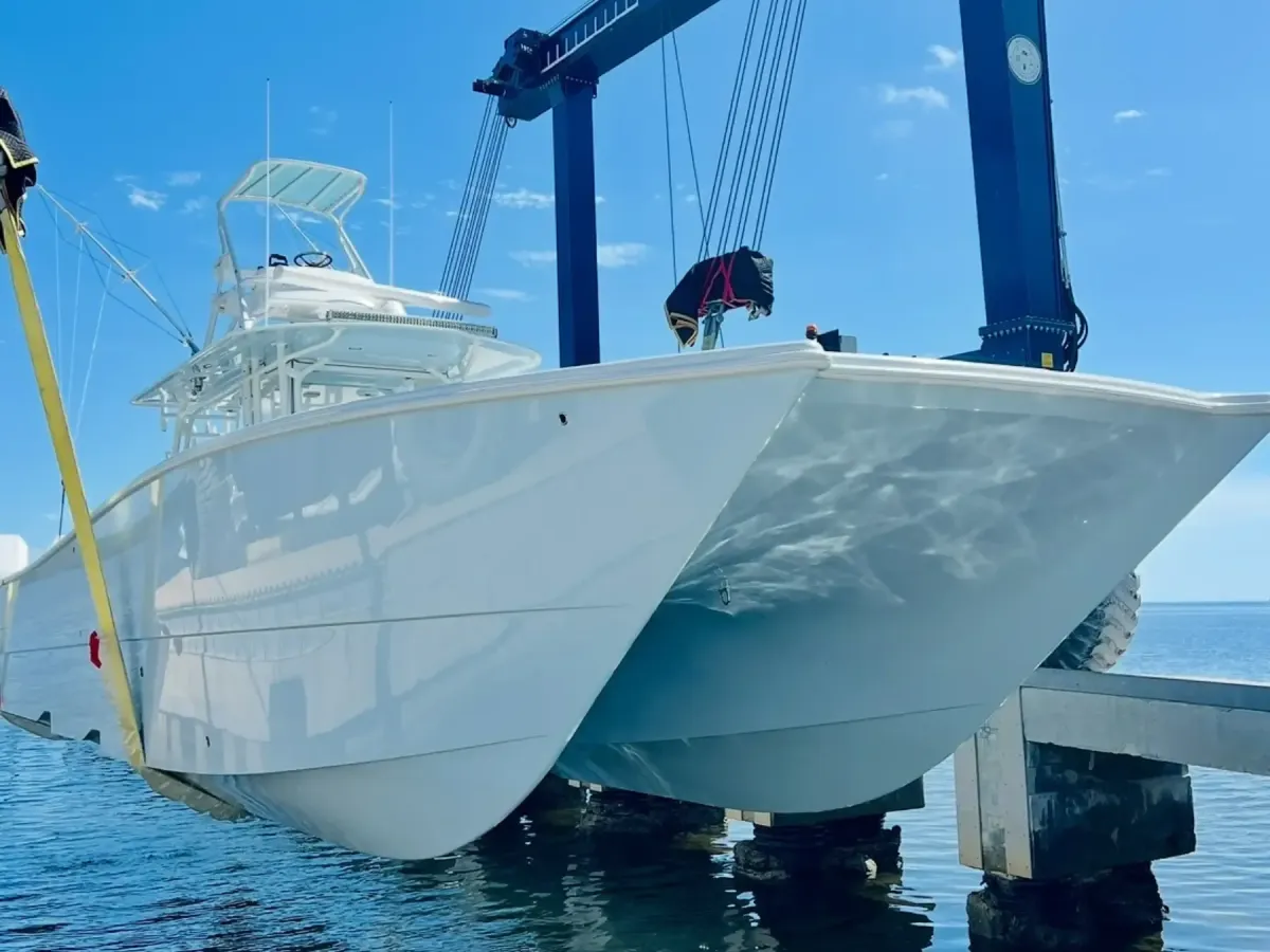 Catamaran being hauled out of water by 80 ton travel lift at BTH Marine 