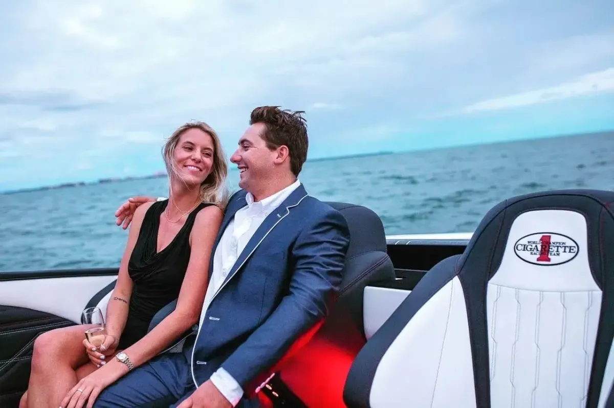 Abigail Doxey and Blye Hofstetter on a cigarette boat