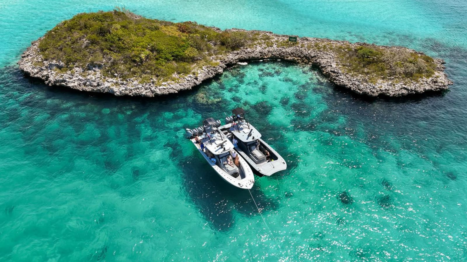 Front Runner center console and catamaran rafted up by an island
