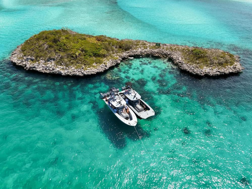 Front Runner center console and catamaran rafted up by an island