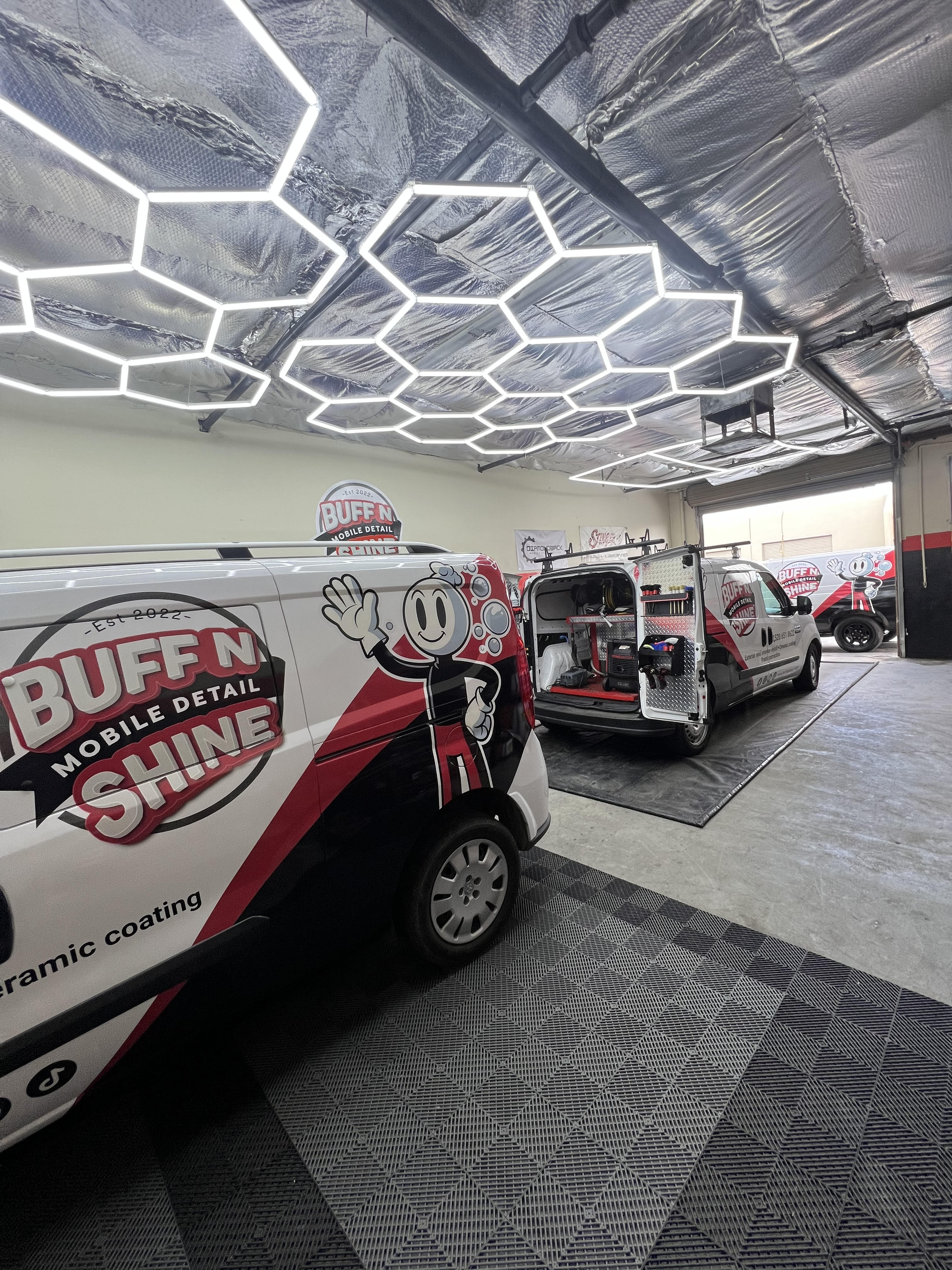 a white tesla car parked on a city street