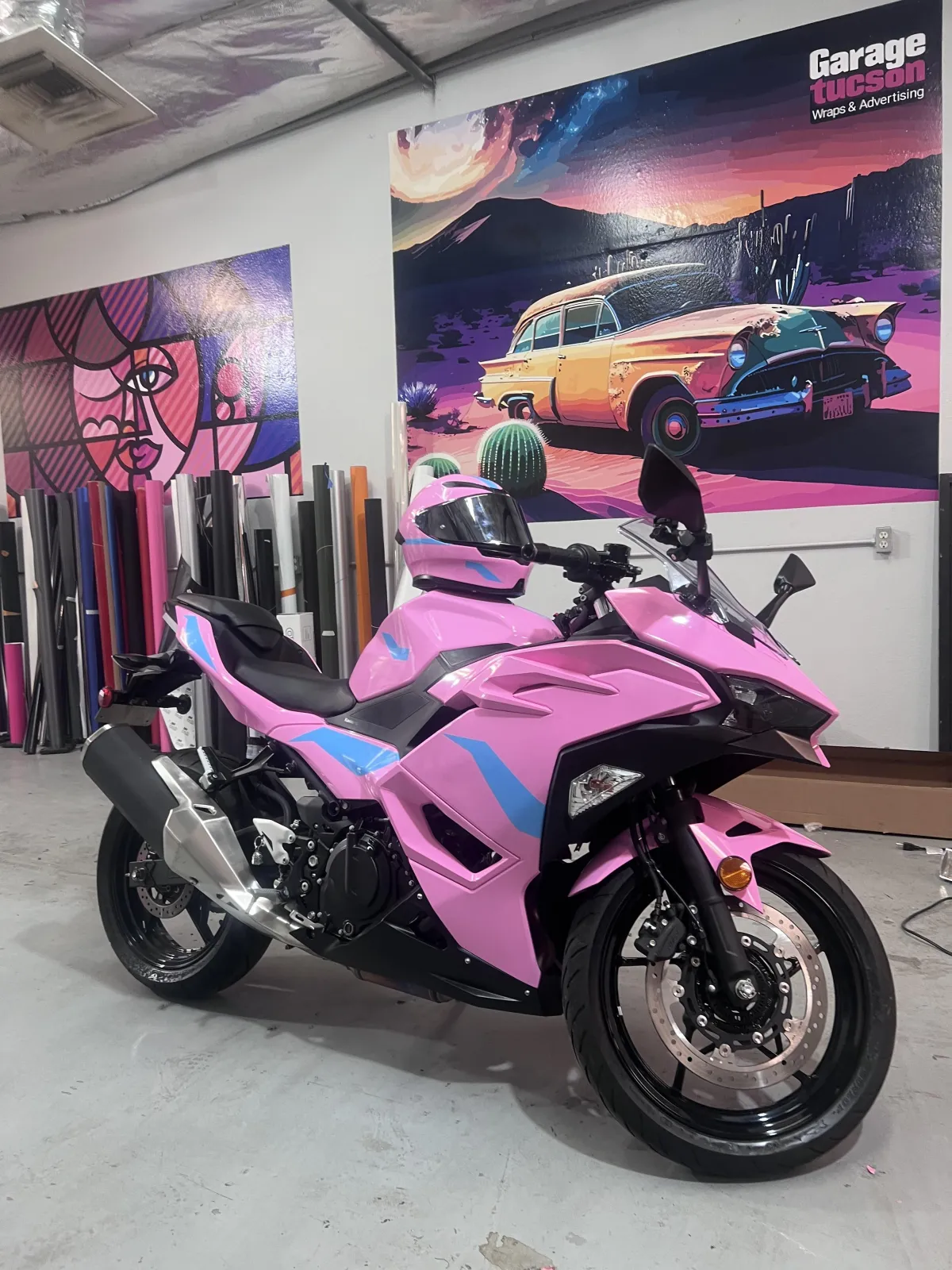 A close-up view of a sporty black car tire.