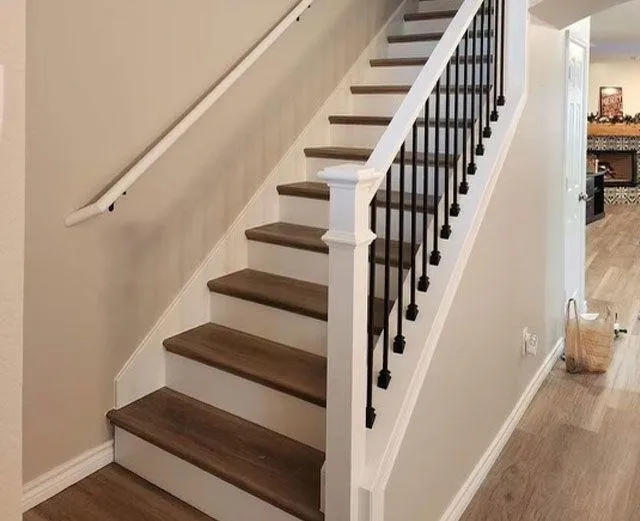 White railing staircase with wooden floors.