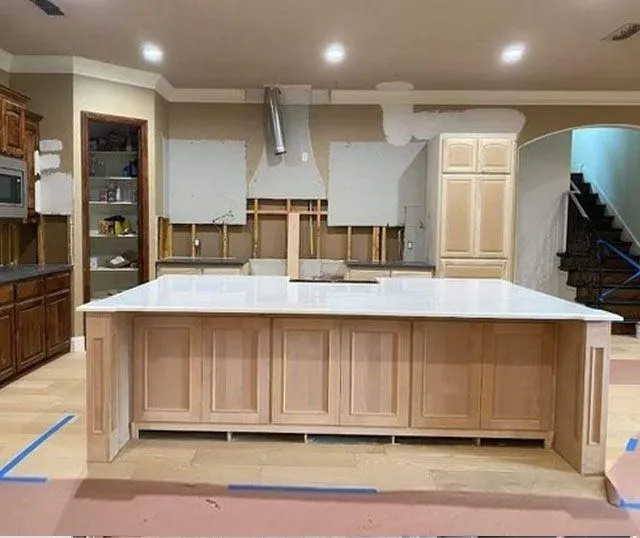 Kitchen with spacious island and cabinets, perfect for cooking and storage