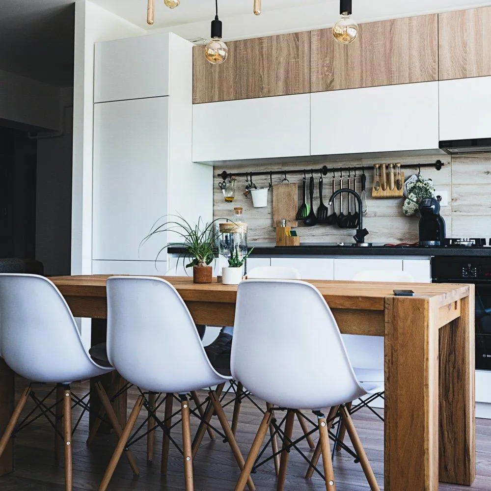 a kitchen with a table and chairs