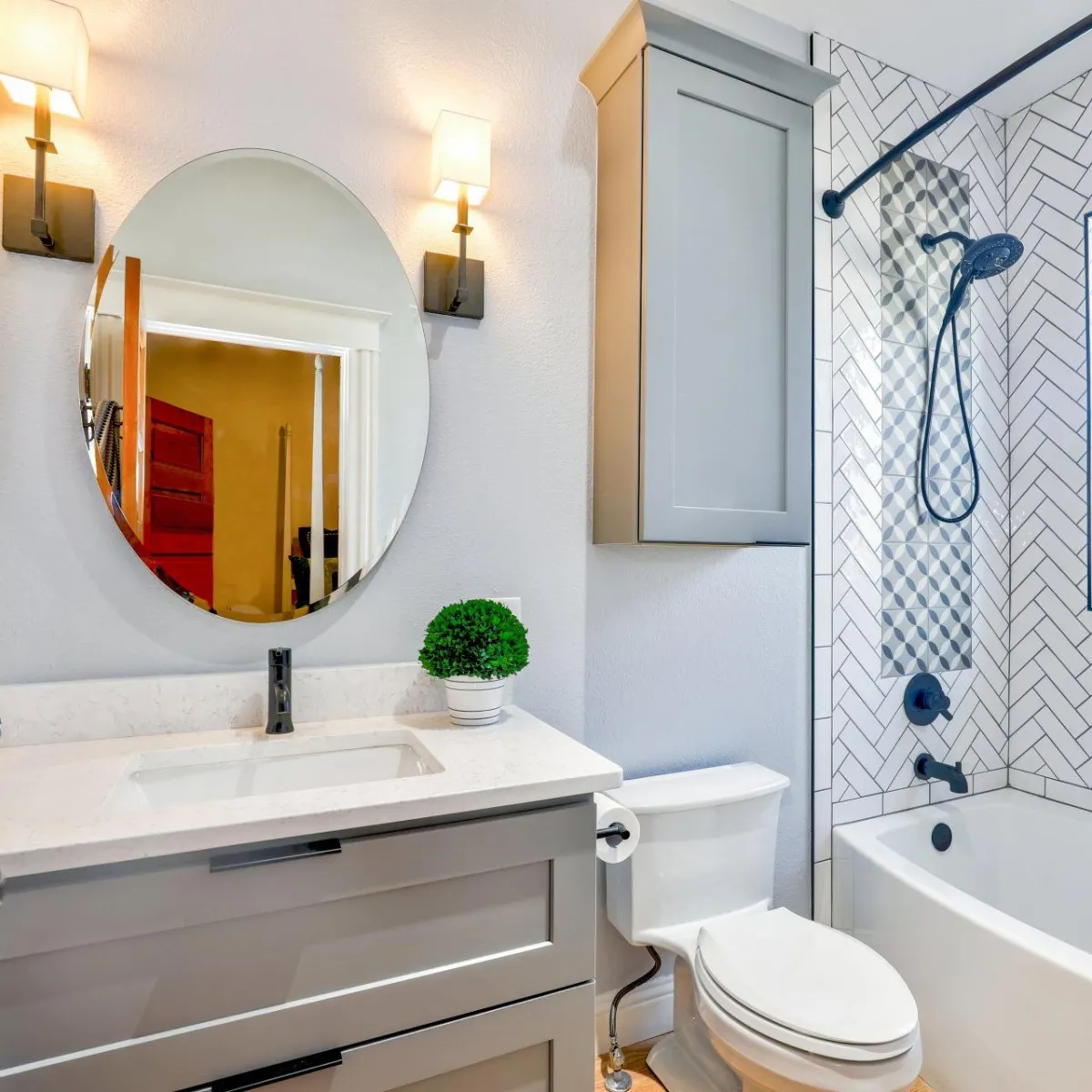 Bathroom with white fixtures: toilet and sink