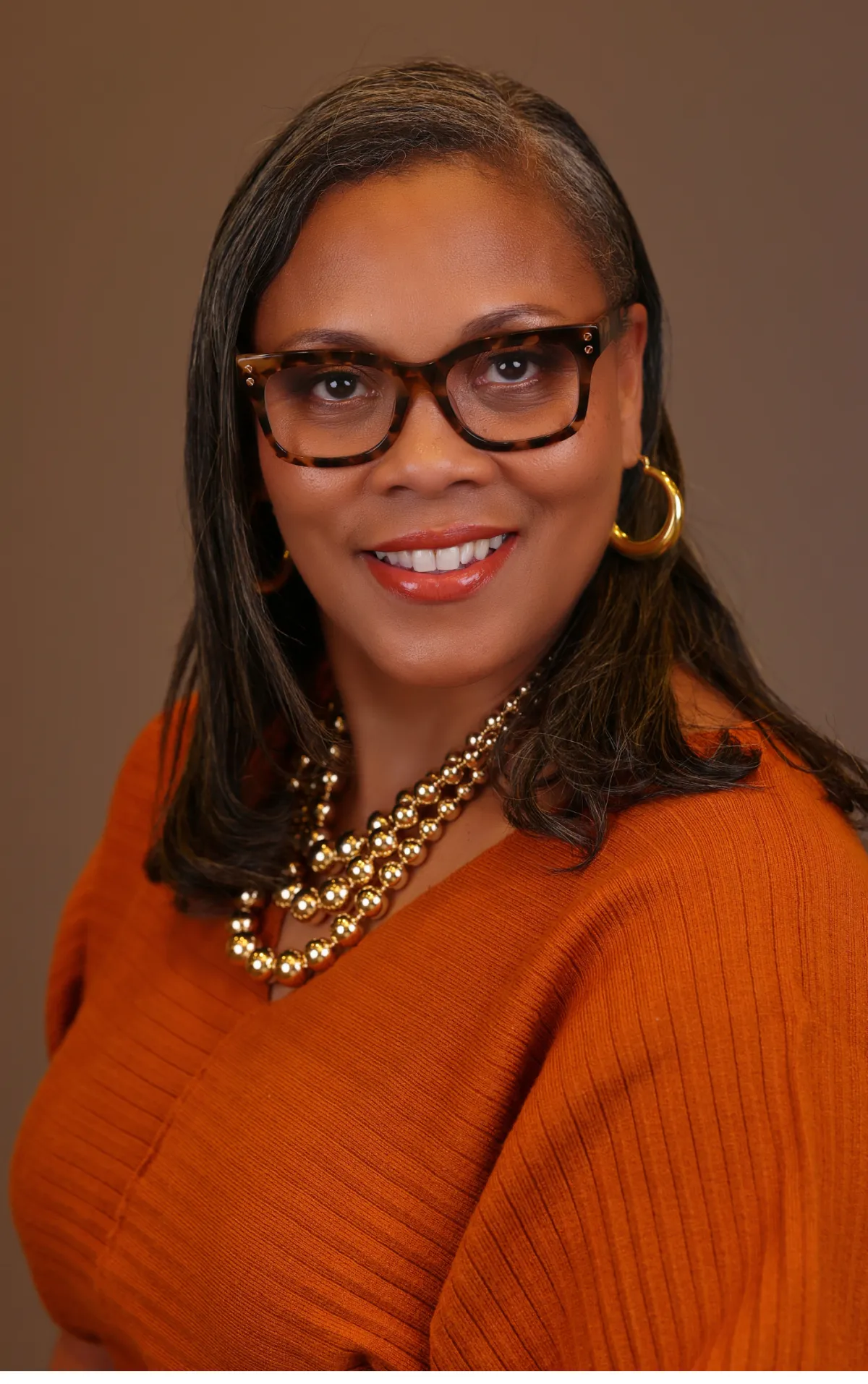 Soft close-up portrait of a confident Black woman,