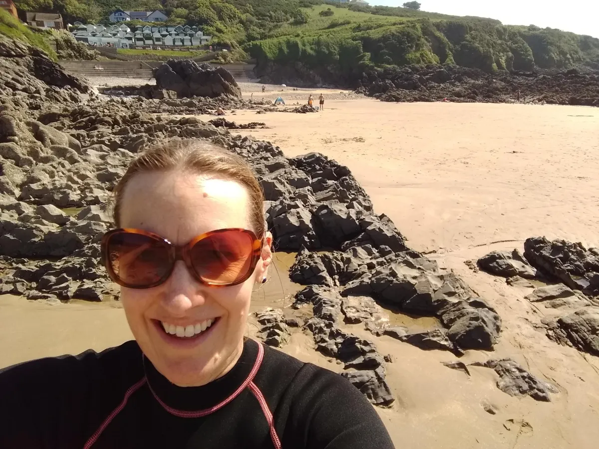 Woman in sunglasses on beach