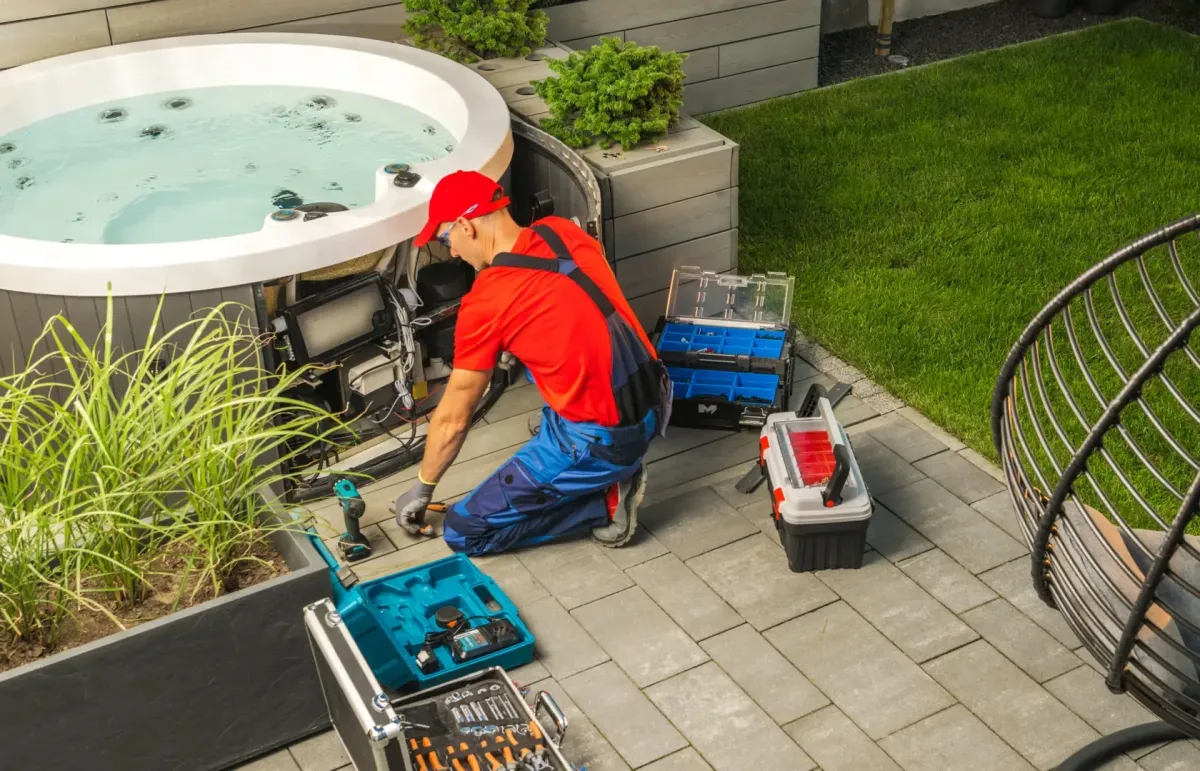 Weekly Pool Maintenance Oak Hill FL — technician skimming a backyard pool — Knight Institutes, LLC