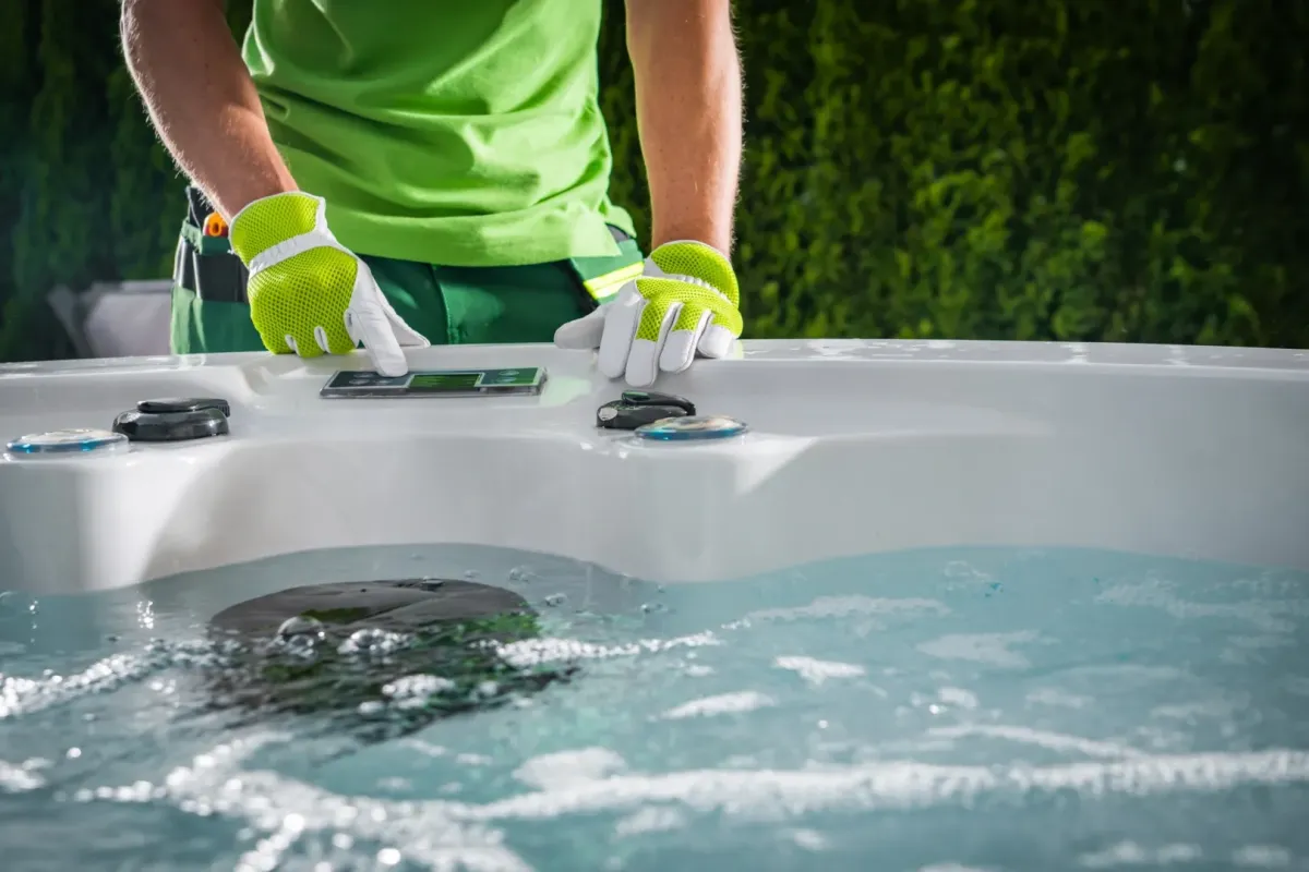 Weekly Pool Maintenance Oak Hill FL — technician skimming a backyard pool — Knight Institutes, LLC