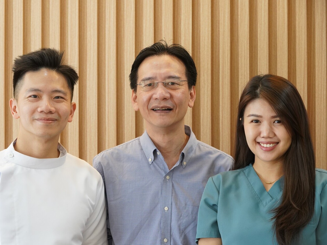 adult male smiling with confidence