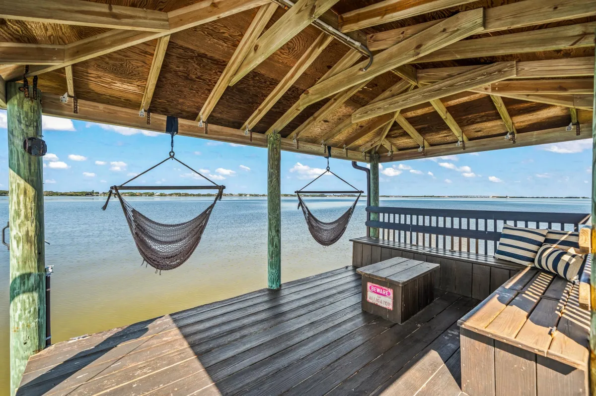 Private dock with 10,000 lb boat lift and lounge area on Banana River
