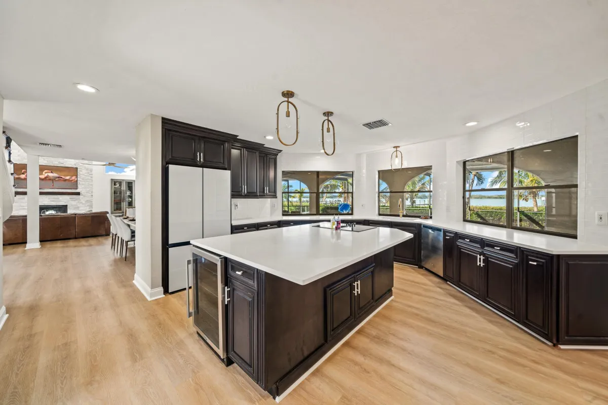 Chef’s kitchen with oversized island and panoramic Banana River views