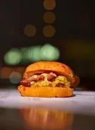 Cup of latte with foam art on table at Serai Cafe & Deli, Lincoln Park