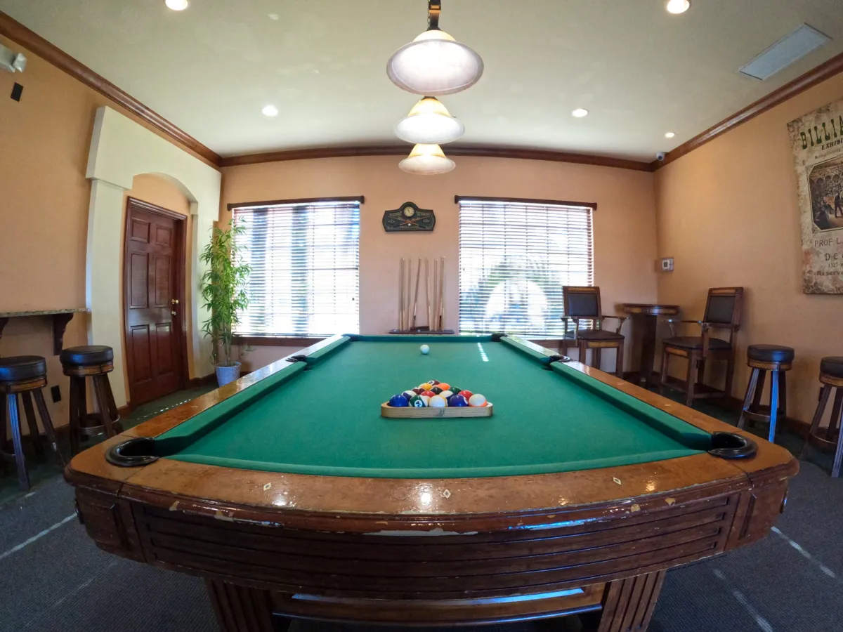 "Grand entrance with fountain and towering royal palms welcoming you to Royal Palm Retreat, luxury monthly rental community Naples FL"
