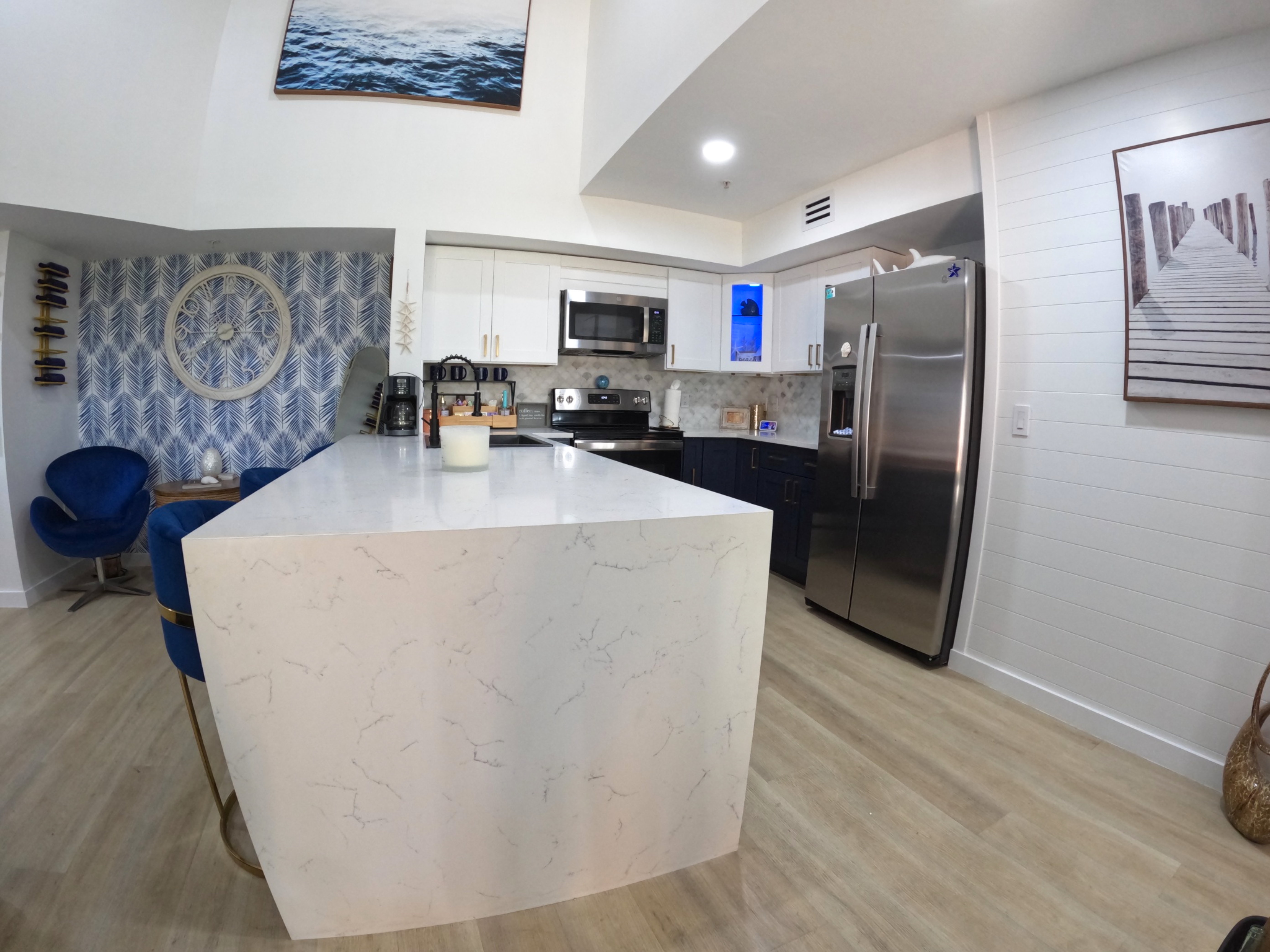 Grocery Delivery Unbox: "Fresh groceries unpacked in kitchen fridge at Royal Palm Retreat, complimentary delivery service for hassle-free monthly rentals Naples."