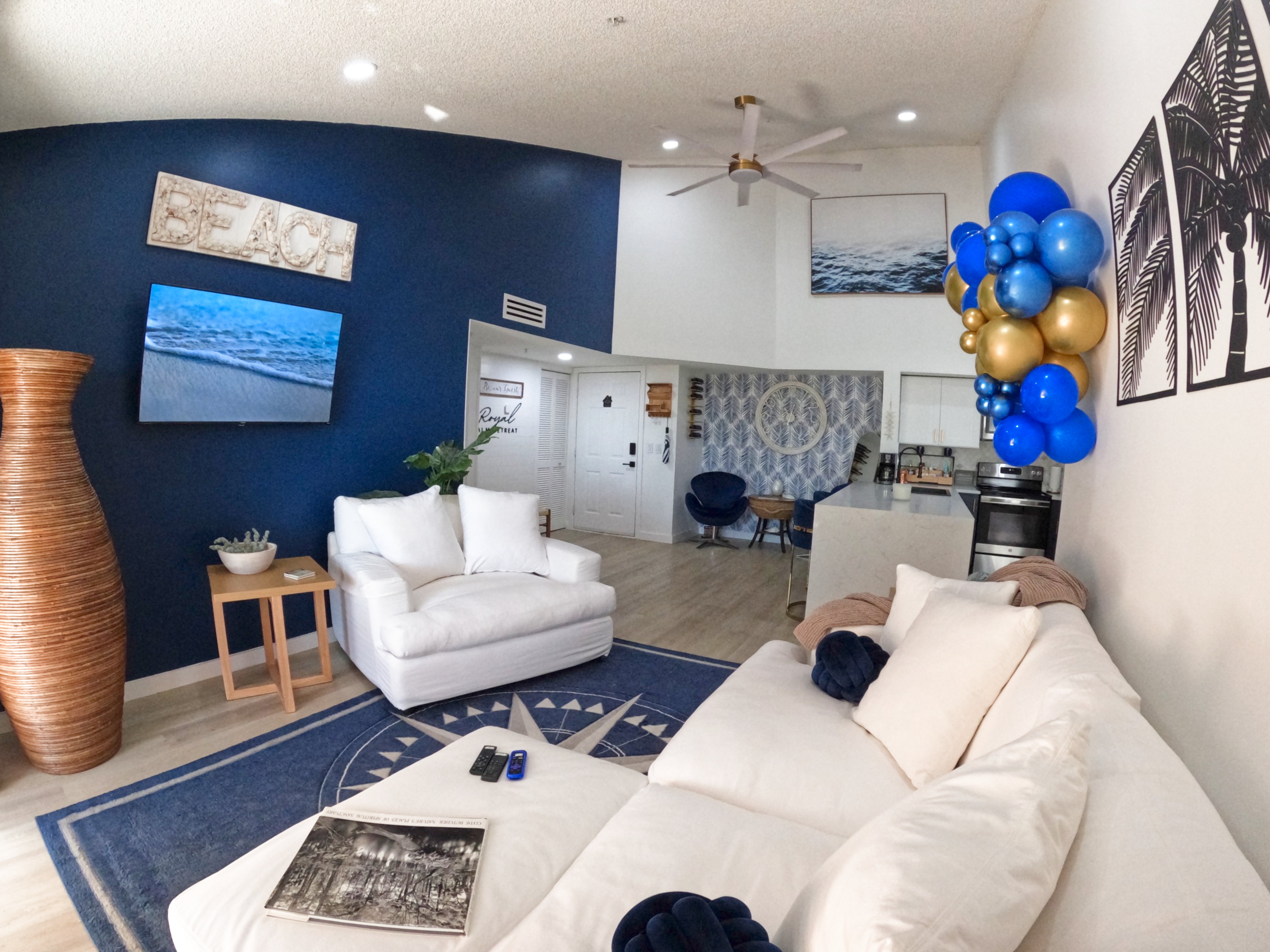 Full Condo Overview: "Panoramic view of navy blue and white beach-themed 2BR/2BA condo at Royal Palm Retreat, sleeps 4 for perfect Naples snowbird season."
