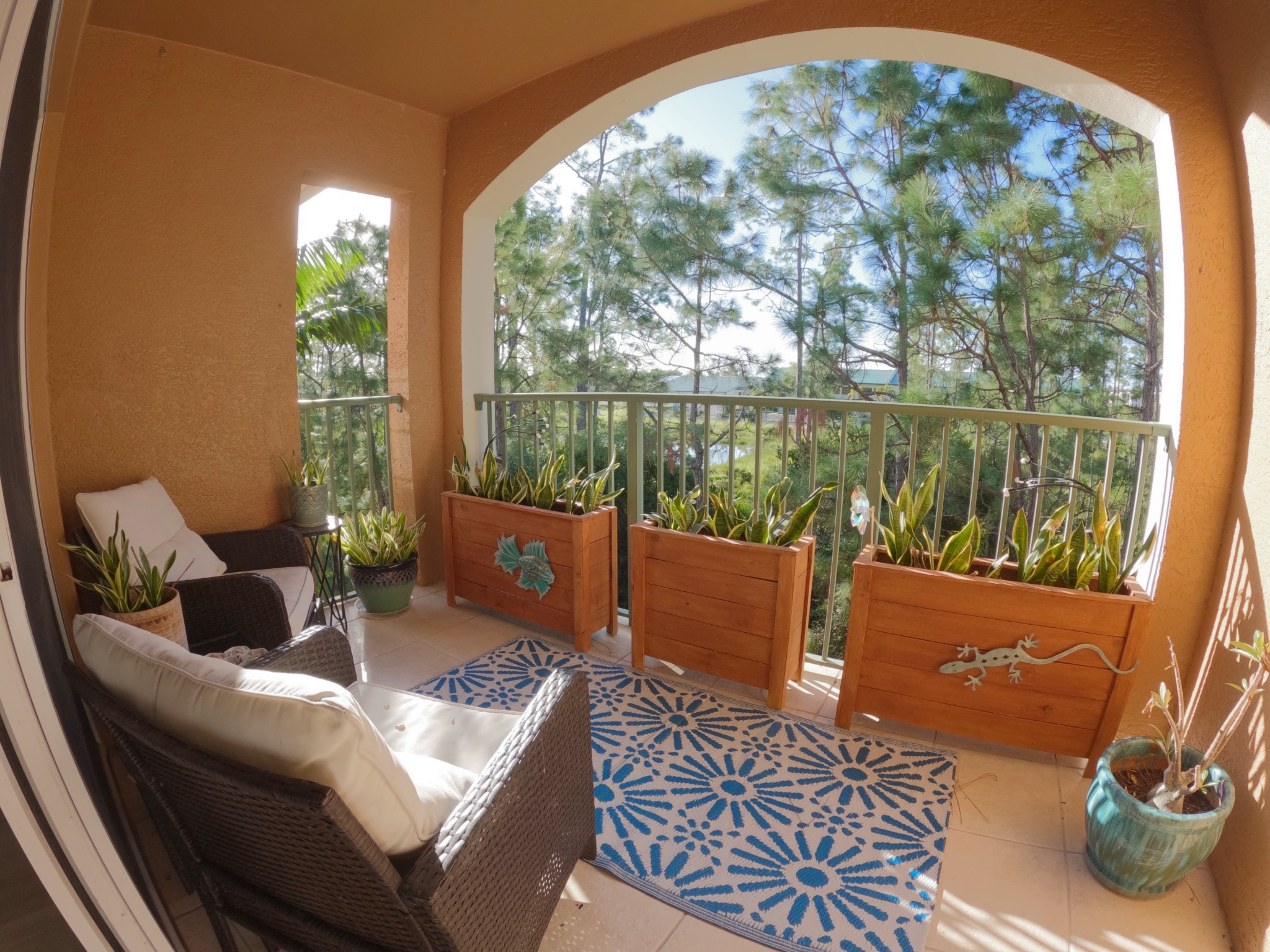 Hero Balcony Sunrise: "Stunning sunrise over wooded view from 3rd-floor balcony at Royal Palm Retreat, ideal Naples FL monthly rental for birdwatching escapes."