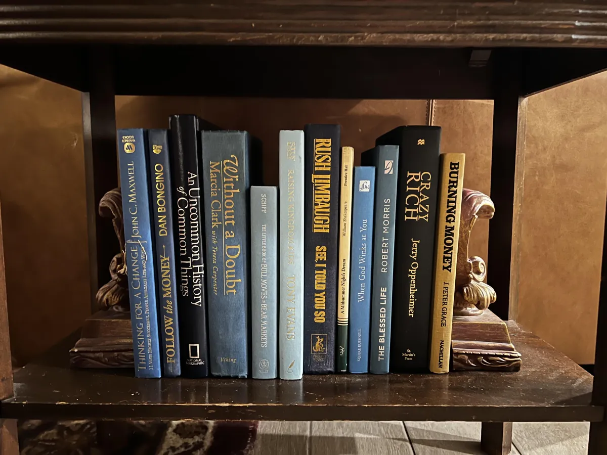 A collection of 12 blue vintage books from The Manor, each with its own history and charm, perfect for adding a touch of classic elegance to any bookshelf.