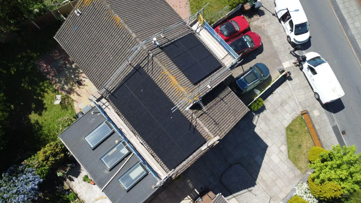 Solar panel and battery installation completed on a residential property in Bootle, Liverpool, featuring concealed cabling, bird protection mesh, and smart energy monitoring.
