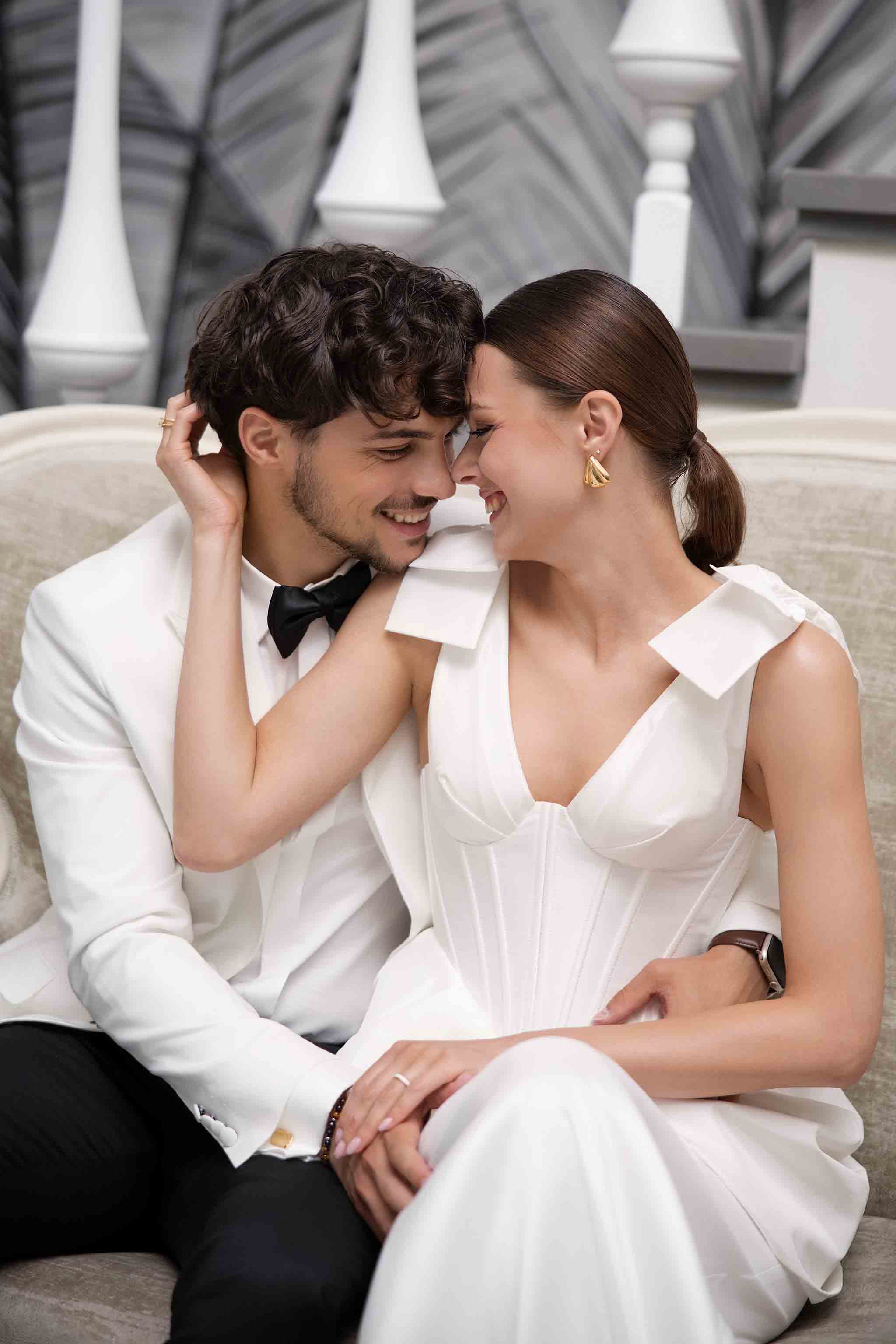 Bride and groom laughing and interacting during a luxury wedding photoshoot in Dubai
