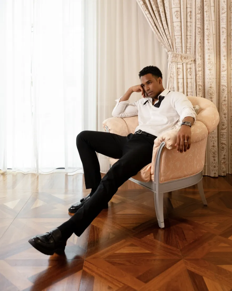 Groom walking naturally during a wedding photoshoot in Warsaw or Dubai or Italy, looking relaxed and stylish.