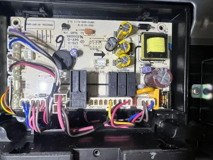 Internal electronic control board of dishwasher being serviced by licensed technician at Sammy Appliance Repair