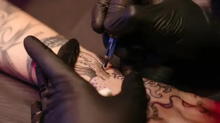 man in white dress shirt standing beside woman in black shirt