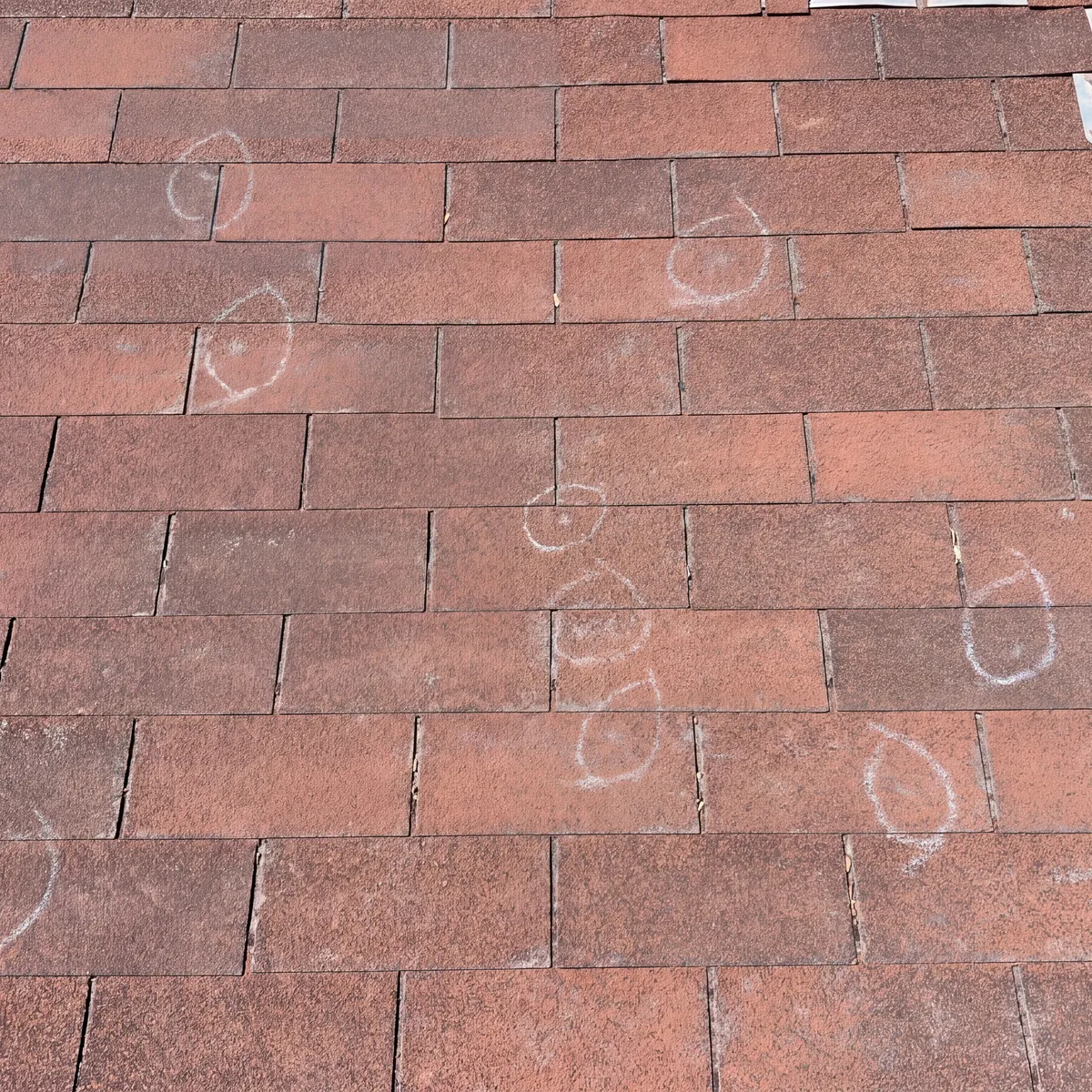 Hail Damage Marked On Roof Shingles In Oklahoma